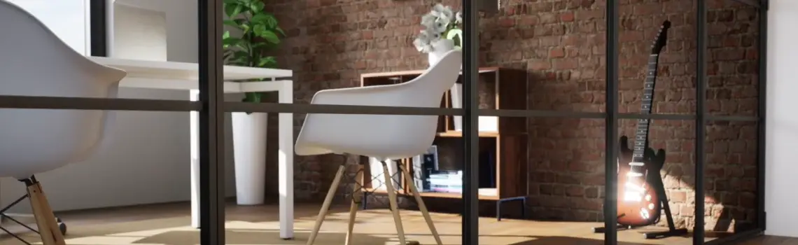KP Glazing London Modern office with white chairs, a desk, potted plant, bookcase, and a guitar resting against an exposed brick wall. Sunlight streams in, creating a bright and cosy atmosphere. View is partially framed by glass panels.