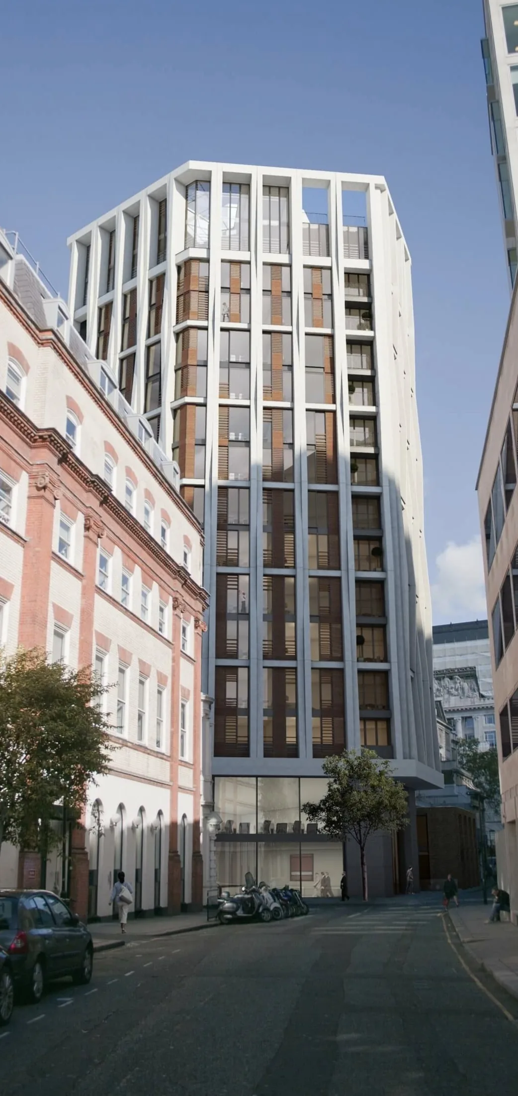 KP Glazing London A modern high-rise building with large windows stands between two older, lower-rise buildings on a city street, with trees and parked bikes visible at ground level.